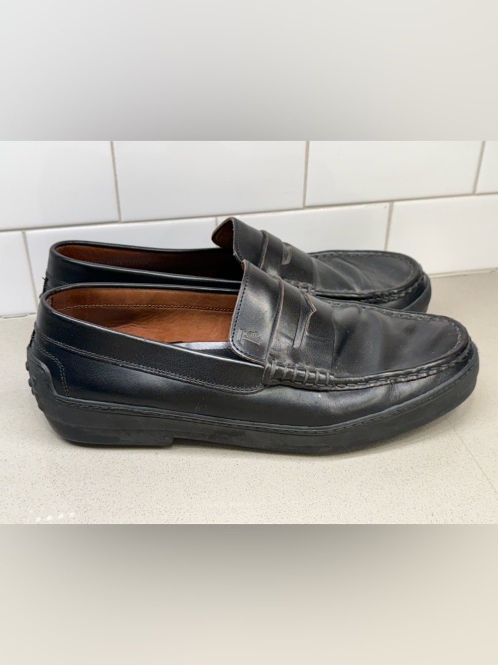 Tod's Black Leather Penny Loafers for Men